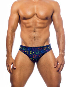 Men's swimwear, slip style, worn by a man, front view, design of the outline of colorful starfish, symbol of the brand, on an ultramarine blue background.