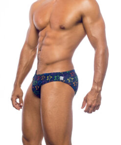 Men's swimwear, slip style, worn by a man, side view, design of the outline of colorful starfish, symbol of the brand, on an ultramarine blue background.