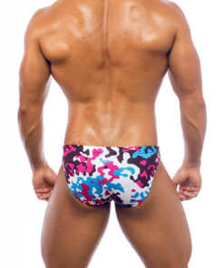 Men's swimwear, slip style, worn by a man, rear view, camouflage pattern with blue, pink, white and brown colors.