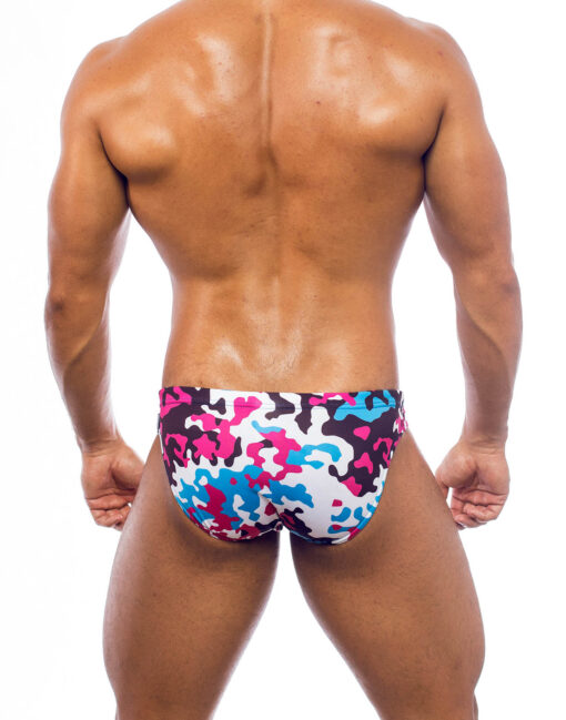 Men's swimwear, slip style, worn by a man, rear view, camouflage pattern with blue, pink, white and brown colors.