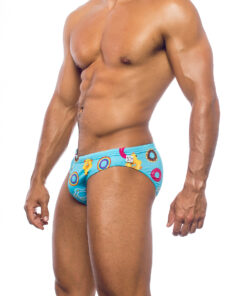 Men's swimwear, slip style, worn by a man, side view, design of inflatable sea toys on a blue background.