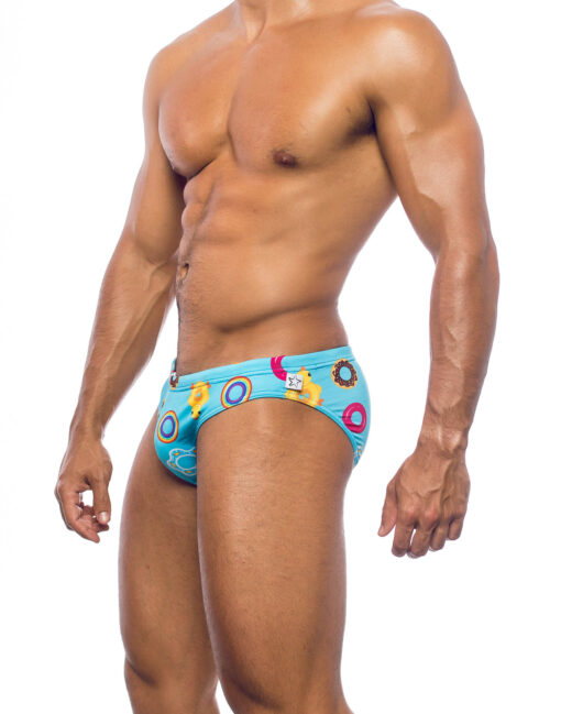 Men's swimwear, slip style, worn by a man, side view, design of inflatable sea toys on a blue background.